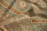 Afshar rug's distressed pile reveals double diamond and hook motifs in dusty blue.