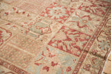 Worn, hand-knotted texture of a Baktiari rug with floral panels in red, blue, and sand tones.