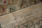 A view of the hand-knotted foundation and restored side cord of a vintage distressed Meshed carpet.