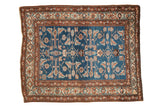 Vintage Northwest Persian rug with a vivid blue Herati design field framed by geometric rust and ivory borders.