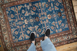Overhead detail of the Herati and Mahi design on the sapphire blue field of a vintage Persian rug.