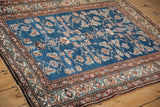 Geometric main border frames the sapphire blue Herati design field of a vintage Persian rug.
