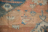 Detail of a primitive samovar motif on an antique Serapi showing wear to the knot heads.