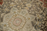 Even wear across the knot heads of the medallion on this antique Farahan Sarouk carpet.