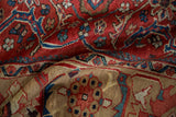 Textured hand-knotted pile of a vintage Mahal showing its brick-red field and sand Herati border.