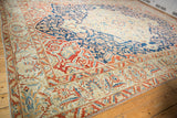 Corner detail of a vintage Baktiari rug showing Samovar Turtle spandrels and a blossom-filled main border.