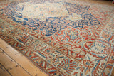 Samovar Turtle motifs in the indigo spandrel and red floral borders of a Baktiari carpet.