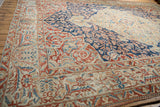Weathered pile showing mostly even wear across the traditional floral motifs of the Baktiari carpet.