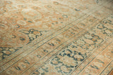 Faded terracotta field, dusty teal palmette border on vintage distressed Khorassan.