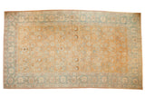 Vintage distressed Tabriz carpet with an allover palmette design in pale rust, ivory, and dusty sky blue.