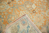 Detailed view of the hand-knotted weave on the back of a vintage Persian rug.