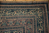 Distressed antique Serbend carpet corner: worn pile, dusty blue, blush, ivory boteh design.