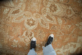 Evenly worn, low pile of a distressed Heriz rug in soothing sand and ivory tones.