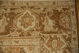 Turtle samovar border motif on a distressed Heriz carpet with even wear to the knot heads.