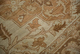 Worn pile of a vintage Heriz carpet revealing the weave in tones of sand, beige, and brown.