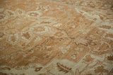 Angled view of a Heriz carpet's even wear, showcasing floral motifs in sand and ivory tones.