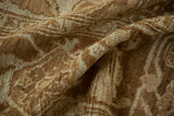 Soft folds revealing the distressed texture and low-pile knots of a vintage Heriz carpet.