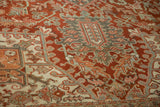 Angled close-up of the even pile on a Heriz rug with geometric serrated leaf motifs.