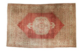 Antique Distressed Bijar Carpet with central palmette medallion, faded cochineal red field, Herati spandrels.