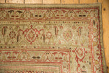 Antique distressed Bijar rug corner with dusty rose turtle samovar border and worn Herati motifs.