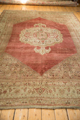 Distressed antique Bijar carpet with faded red field, Herati corner, and turtle samovar border.