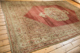 Faded dusty rose and beige Herati and turtle samovar patterns on antique Bijar rug.