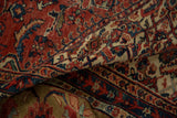 Antique Mahal carpet fold displays brick red field, sprawling blue floral motifs, and Herati border.