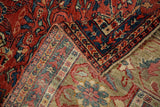 Antique Mahal carpet corner revealing red field with sprawling Herati patterns and striped foundation with intact selvage.