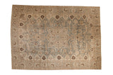 Distressed vintage Tabriz carpet with medallion, floral field, muted slate blue and beige tones.