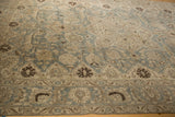 Distressed vintage Tabriz carpet with slate blue, beige florals and ornate brown border.