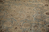 Distressed vintage Tabriz carpet with worn slate blue and beige lotus flower palmette design.