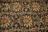 Hand-knotted pile of antique Malayer carpet, with navy blue, beige, and brown palmette motifs.