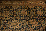 Antique Malayer rug's palmette pattern in navy, beige, and green, showing mostly even wear.