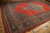 Wide angle view of the antique Bijar carpet, displaying the full scale of its grand traditional design.