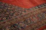 Detailed corner view of an antique Bijar's Herati spandrel and complex Samovar Turtle border.