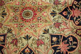 Finely detailed starburst medallion and floral sprays on a tea-washed antique Kerman rug.