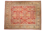 Vintage distressed Mahal carpet with an allover floral design in cherry red, saffron yellow, and powder blue hues.