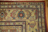 Detailed Herati and boteh border motifs on the saffron yellow corner of a distressed Mahal rug.