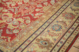 Main Herati border and boteh motifs on the corner of a distressed vintage Mahal carpet.