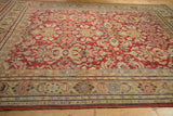 Vintage distressed Mahal carpet showing the cherry red field and saffron yellow Herati-style border.