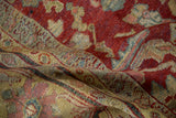Softly draped vintage Mahal carpet showing its knot-head texture in red, blue, and saffron.