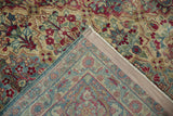 Close-up of the vintage Persian rug's hand-knotted back, weave, and restored side cord selvage.