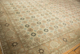 Perspective view of a distressed Qom rug with allover floral rows and a Turtle Samovar border.