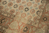 Terracotta Turtle Samovar border meets the distressed floral field of a vintage Persian Qom carpet.