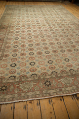 Worn corner of a distressed Qom carpet shows the terracotta Turtle Samovar border design.