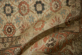 Worn pile of a vintage Persian Qom showing floral details and the Turtle Samovar border motif.