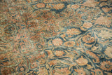 Distressed texture highlighting dusty blue and rose curvilinear floral arabesques.