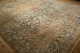 Decorative distressed floral arabesques and border in dusty sapphire, blush, and cream.