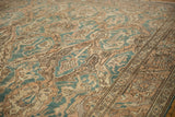 Evenly worn distressed vintage Sparta rug, dusty teal and sand floral arabesque pattern.