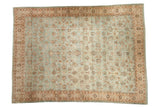 Distressed vintage Meshed carpet with an allover floral design in powder blue, beige, and brown.